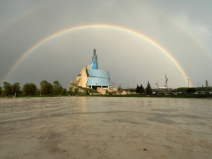 A double rainbow is visible over the Human Rights Museum on May 16, 2024 (Michelle Fox Chan)