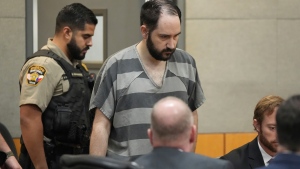FILE - Daniel Perry enters the courtroom at the Blackwell-Thurman Criminal Justice Center, May 10, 2023, in Austin, Texas. (Jay Janner/Austin American-Statesman via AP, Pool, File)