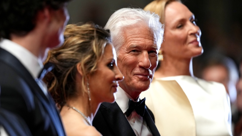 Uma Thurman, from right, Richard Gere, and Alejandra Silva pose for photographers upon arrival at the premiere of the film 'Oh, Canada' at the 77th international film festival, Cannes, southern France, Friday, May 17, 2024. (Scott A Garfitt / Invision / AP)