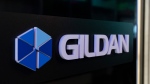 The Gildan logo is seen outside their offices in Montreal, Monday, Dec. 11, 2023. U.S. investment firm Browning West has requested a special meeting of Gildan Activewear Inc. shareholders to replace a majority of the company's directors and reinstate Glenn Chamandy as chief executive. (Christinne Muschi, The Canadian Press)