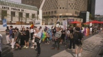 Marchers walked backwards in downtown Montreal to show support for the LGBTQ2S+ community and symbolize the rollback of rights seen throughout many communities. (CTV News)