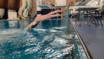 One of the swimmers dives into the pool at the Centennial Pool in Halifax. (CTV/Hafsa Arif)