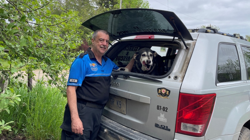 William Bolton stands with his dog Sheeba, who recently retired from her search and rescue work after 11 years. May 18, 2024 (Hannah Schmidt/CTV News)
