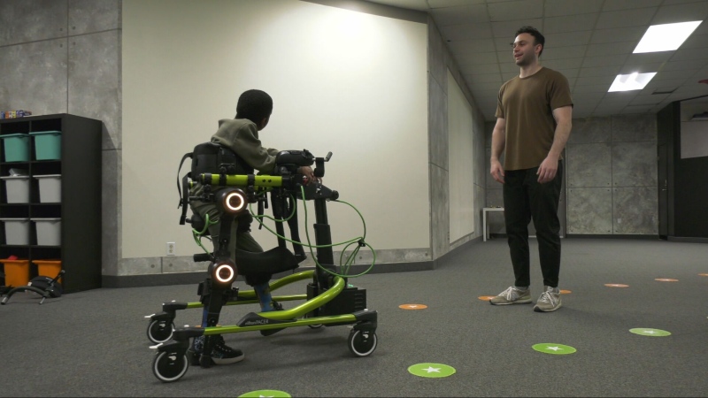 Seven-year-old Jahir Ajabo, who has cerebral palsy, tests out Trexo Robotics' robotic gait trainer on May 18, 2024. (Alexandra Holyk/CTV News Winnipeg)