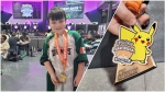 Brantley Meharg, 7, shows off a medal he received for placing in the top-eight at a recent Pokémon regional championship tournament. Despite having just started playing Pokémon two years ago, Meharg is heading to Hawaii this summer to compete at worlds. (Sanjay Maru/CTV News Windsor) 