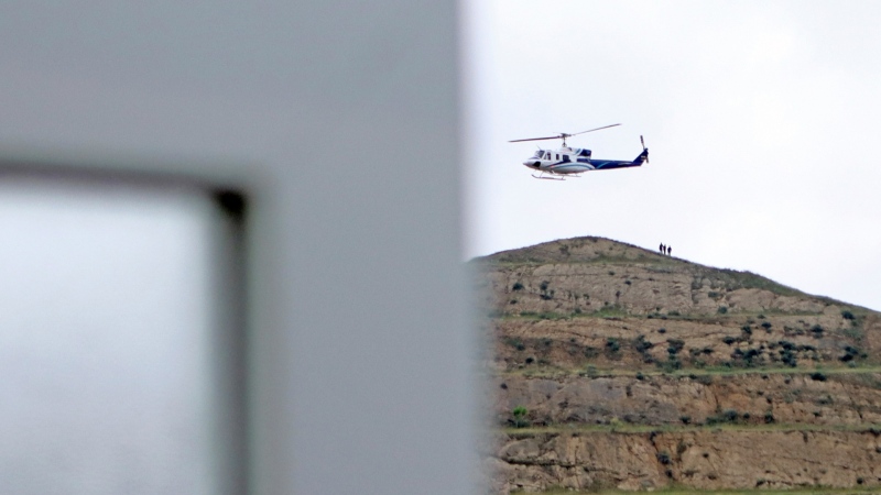 In this photo provided by Islamic Republic News Agency, IRNA, the helicopter carrying Iranian President Ebrahim Raisi takes off at the Iranian border with Azerbaijan after President Raisi and his Azeri counterpart Ilham Aliyev inaugurated the dam of Qiz Qalasi, or Castel of Girl in Azeri, Iran, Sunday, May 19, 2024. (Ali Hamed Haghdoust/IRNA via AP)