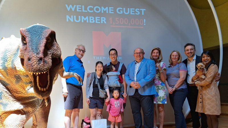THEMUSEUM in Kitchener welcomed their 1,500,000 guest, the Feng family, on May 19, 2024. Left to right: Maverick THEDINO, CEO of THEMUSEUM David Marksell, Tamryn Feng, Vincent Feng, Matthew Feng, Izzy Feng, Kitchener Mayor Berry Vrbanovic, THEMUSEUM board of directors Vice President Linda Fabi, THEMUSEUM board of directors member Jacqueline Hewson, THEMUSEUM board of directors member Pejman Salehi, Waterloo MP Bardish Chagger. (Shelby Knox/CTV News)