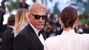 Kevin Costner, left, poses for photographers upon arrival at the premiere of the film 'Horizon: An American Saga' at the 77th international film festival, Cannes, southern France, May 19, 2024. (Photo by Vianney Le Caer/Invision/AP)