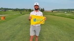 Cam Kellett of London, Ont. poses with an RBC Canadian Open Flag after qualifying for the upcoming PGA Tour Event at Hamilton Golf and Country Club (Source: Cam Kellett/Golf Canada)
