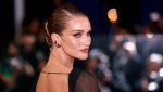 Rosie Huntington-Whiteley poses for photographers upon arrival at the premiere of the film 'The Shrouds' at the 77th international film festival, Cannes, southern France, Monday, May 20, 2024. (Photo by Vianney Le Caer / Invision / AP)