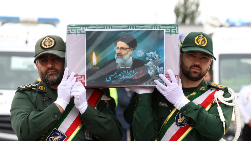 Revolutionary Guard members carry the flag-draped coffin of President Ebrahim Raisi on Tuesday, May 21, 2024. (Iranian Presidency Office via AP)
