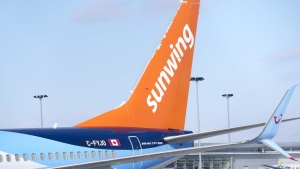 A Sunwing aircraft is parked at Montreal Trudeau Airport in Montreal. (Pasul Chiasson/The Canadian Press)