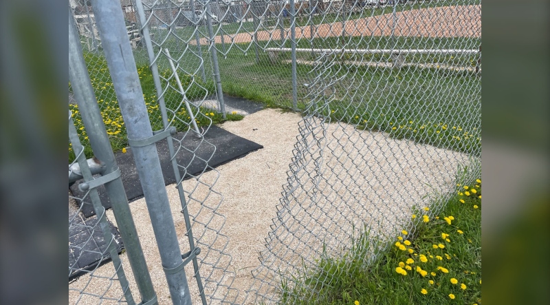The cut fence at the Norberry-Glenlee Community Centre batting cage where a number of items were stolen on May 17, 2024. (Jamie Dowsett/CTV News Winnipeg)