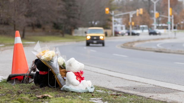 A memorial sits on Riverside Drive near Wonderland Road for victims in London, Ont., on Wednesday, Dec. 1st, 2021, following a fatal collision involving pedestrians Tuesday night. THE CANADIAN PRESS/Nicole Osborne