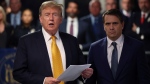 Former U.S. President Donald Trump speaks alongside his attorney Todd Blanche following the day's proceedings in his trial Tuesday, May 21, 2024, in Manhattan Criminal Court in New York. (Michael M. Santiago / Pool Photo via AP)