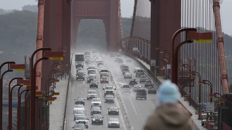 A person watches as traffic drives across the Golden Gate Bridge in Sausalito, Calif. (Jeff Chiu/AP Photo)