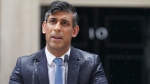 Britain's Prime Minister Rishi Sunak delivers a statement, outside 10 Downing Street, London, Wednesday, May 22, 2024. (Stefan Rousseau / PA via AP)