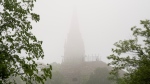 The Peace Tower is seen shrouded in fog, Wednesday, May 22, 2024 in Ottawa. Temperatures are expected to rise above 30C with humidity. (Adrian Wyld/THE CANADIAN PRESS)