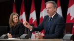 Deputy Prime Minister and Minister of Finance Chrystia Freeland looks on as Minister of Health Mark Holland speaks during a news conference, Tuesday, May 21, 2024 in Ottawa. THE CANADIAN PRESS/Adrian Wyld