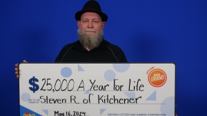 Steven Rozon, 52, celebrating after winning the lottery. (Source: OLG)