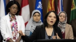 NDP MP for Vancouver East Jenny Kwan (front) speaks during a news conference, Wednesday, May 22, 2024 in Ottawa. (Adrian Wyld/The Canadian Press)
