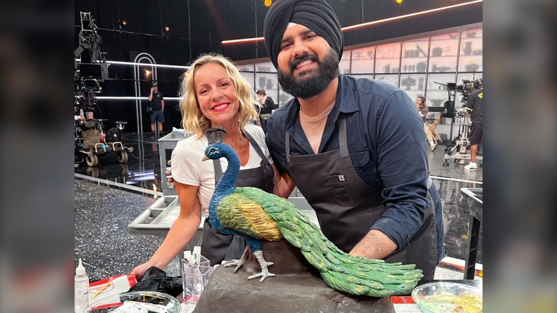 Jujhar Mann poses with his finale bake on Netflix's Is It Cake. (Mann & Co Bakeshop/Facebook)