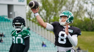 Saskatchewan Roughriders quarterback Mason Fine (8) throws the football before a spring training scrimmage in Saskatoon, Sask., on Saturday, May 18, 2024. THE CANADIAN PRESS/Heywood Yu