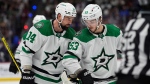 Dallas Stars captain Jamie Benn, left, confers with centre Wyatt Johnston during NHL playoff action on May 13, 2024, in Denver against the Colorado Avalanche. (David Zalubowski/Associated Press)