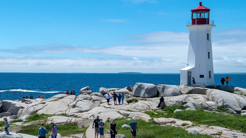 Visitors explore Peggy's Cove, N.S., Saturday, July 4, 2020. THE CANADIAN PRESS/Andrew Vaughan