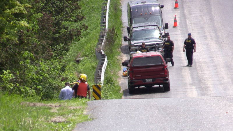 Police and emergency crews investigate reports of a possible body in a creek near Thornton on County Road 21 on Wed., May 23, 2024. (CTV News/Mike Arsalides) 