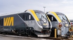 New passenger trains sit on the tracks at the Via Rail Canada Maintenance Centre in Montreal, Thursday, Feb. 22, 2024. (THE CANADIAN PRESS/Christinne Muschi)