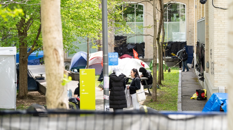University of Quebec at Montreal has filed an injunction request against pro-Palestinian protesters that set up an encampment on its campus a little over a week ago. Activists are seen in a new pro-Palestinian protest encampment set up on the UQAM grounds, in Montreal, Monday, May 13, 2024. THE CANADIAN PRESS/Christinne Muschi
