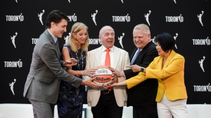 Prime Minister Justin Trudeau (left to right), WNBA Commissioner Cathy Engelbert, Larry Tanenbaum of Kilmer Sports Ventures, Ontario Premier Doug Ford, and Toronto Mayor Olivia Chow pose during a news conference announcing the city's WNBA franchise in Toronto on Thursday, May 23, 2024. THE CANADIAN PRESS/Christopher Katsarov