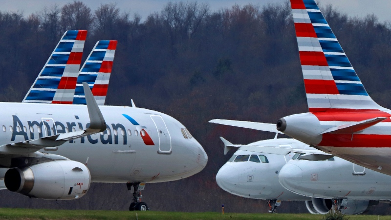FILE - American Airlines planes are parked at Pittsburgh International Airport on March 31, 2020, in Imperial, Pa. (AP Photo/Gene J. Puskar, file)