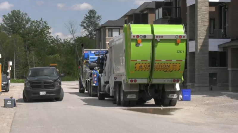 A recycling truck is pictured on Red Maple Lane in Barrie, Ont., on Thurs., May 23, 2024. (CTV News/Mike Arsalides)