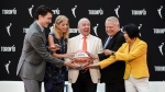 Prime Minister Justin Trudeau (left to right), WNBA Commissioner Cathy Engelbert, Larry Tanenbaum of Kilmer Sports Ventures, Ontario Premier Doug Ford, and Toronto Mayor Olivia Chow pose during a news conference announcing the city's WNBA franchise in Toronto on Thursday, May 23, 2024. THE CANADIAN PRESS/Christopher Katsarov
