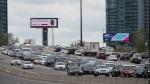 FILE - Vehicles drive along the Gardiner Expressway in Toronto at the start of the May long weekend on Saturday, May 22, 2021. THE CANADIAN PRESS/Tijana Martin 