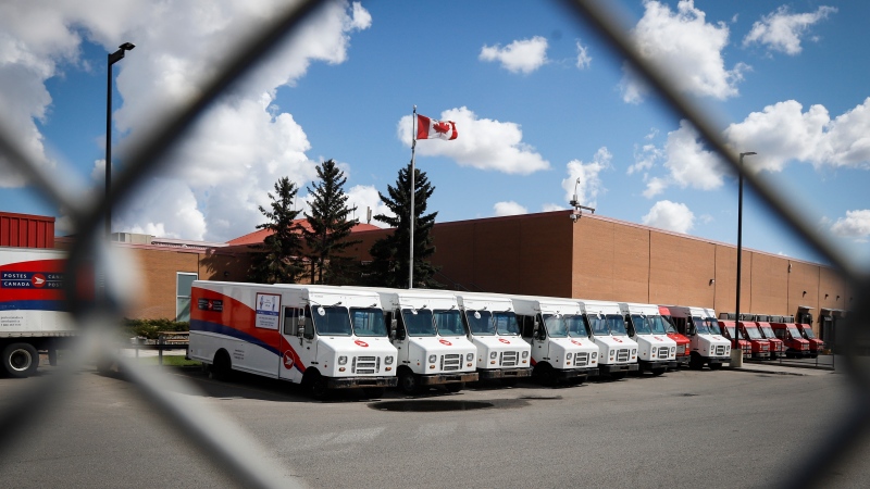 Delivery vehicles are seen at Canada Post's main plant in Calgary, Alta., Saturday, May 9, 2020. THE CANADIAN PRESS/Jeff McIntosh