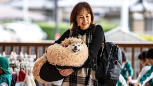 The late Kabosu pictured with her owner Atsuko Sato in Chiba prefecture, east of Tokyo, on March 19, 2024 (Philip Fong / AFP / Getty Images via CNN Newsource)
