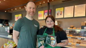 Dan Collings, with Second Harvest, and Starbucks store manager Taylor MacLean on May 24, 2024. (Ashley Bacon/CTV Kitchener)