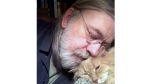 This undated self portrait made available by Little Brown publisher, shows author Caleb Carr and his cat Masha at his home in Cherry Plain, NY. Carr died of cancer Thursday, May 23, 2024, according to his publisher, Little, Brown and Company. (Caleb Carr/Little Brown via AP)