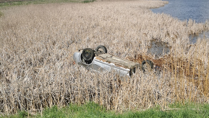 RCMP officers rescued a driver who went off the road, flipped his car and landed in a ditch filled with water on May 22, 2024. (RCMP)