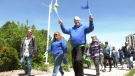 Dozens gathered at the steps of Sault Ste. Marie’s city hall Friday for a moment 70 years in the making. For the first time in its history, Community Living Algoma had its flag raised at the Ronald A. Irwin Civic Centre. (Photo from video)