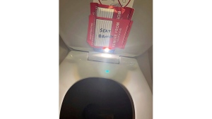  In this photo provided by the law firm Lewis & Llewellyn LLP, an iPhone is taped to the back of a toilet seat on an American Airlines flight from Charlotte, N.C., to Boston, Sept. 2, 2023. (Lewis & Llewellyn LLP via AP, File)