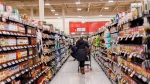 A shopper browses in an aisle at a grocery store in Toronto, Feb. 2, 2024. THE CANADIAN PRESS/Cole Burston