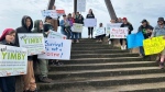 Protesters gather to march against homelessness at the spirit catcher in Barrie Ont, on May 25, 2024 (CTV News/Mike Lang).