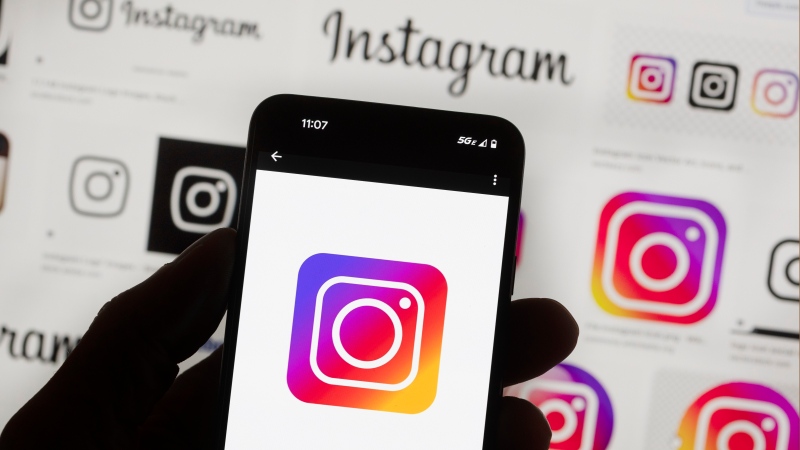 The Instagram logo seen on a cell phone in Boston on October 14, 2022. (AP Photo/Michael Dwyer, Archives)

