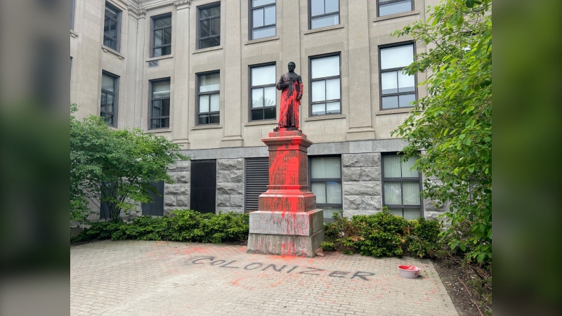 The statue of J.H. Tabaret at the University of Ottawa (uOttawa) has been vandalized, as a picture taken by CTV News Ottawa shows red paint sprayed all over it. (Katelyn Wilson/ CTV News Ottawa) 