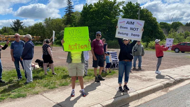 Around 30 people gathered at the corner of Mill Road and Toombs Street to voice their concerns over the AIM Recycling operation in Moncton Saturday morning. (Derek Haggett/CTV News)