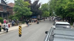 Shoppers walk along Fourth Avenue at the Great Glebe Garage Sale in Ottawa on May 25, 2024. (William Eltherington/CTV News Ottawa)